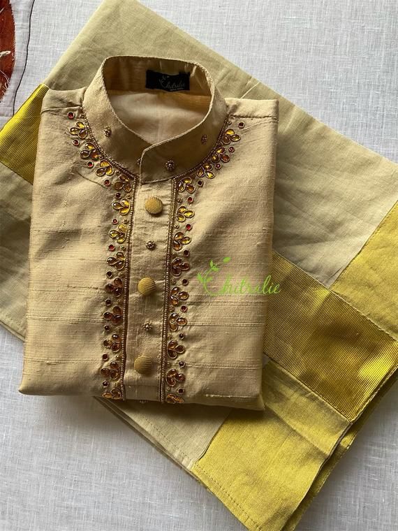 The Outfit consists of Kurtha and Mundu.The Kurtha made of Rawsilk fabric and is embellished with maggam work.The quality and embellishments makes this unique.The Mundu is made of premium quality Kerala Handloom Kasavu fabric.Velcro pasting at waist. So it’s easy to wear for kids.The Kurtha is lined with soft cotton fabric.Size: The picture shows 5-7 year baby boys dress.Any customisation of colours of Kurtha, please let me know. Festive Embellished Multicolor Embroidered Set, Eid Embellished Multicolor Embroidered Sets, Diwali Embellished Multicolor Embroidery Sets, Eid Embellished Multicolor Embroidery Sets, Embellished Multicolor Embroidery Sets For Eid, Unstitched Embellished Traditional Sets, Embellished Fitted Kurta In Raw Silk, Traditional Embellished Set With Multicolor Embroidery, Traditional Embellished Transitional Kurta