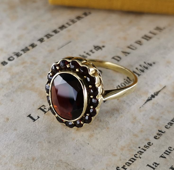 Beautiful rare antique German ring, 14k gold garnet ring, the ring face measures 13x 17 mm, US Size 8 1/2, the ring is in good condition.  Material: 14k gold, garnet Total weight: approx. 4.8 g US Size: approx. 8 1/2 (EU size 58) Box on the photos not included! PLEASE LOOK AT THE PICTURES, THEY ARE PART OF THE DESCRIPTION AND ARE THE ACTUAL ITEM YOU WILL RECEIVE. Antique Yellow Gold Cluster Ring With Gemstone, Antique Gold Cluster Ring, Antique Gold Cluster Ring With Gemstones, Antique Gemstone Cluster Ring For Formal Occasions, Antique Formal Cluster Ring With Gemstone, Antique Brown Rings For Anniversary, Heirloom Gold Garnet Rings, Brown Hallmarked Vintage Ring, Antique Brown Wedding Rings