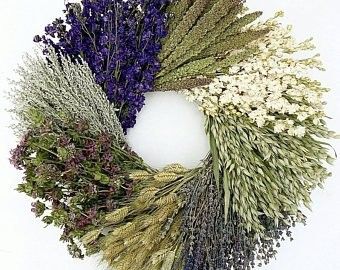 a bunch of dried flowers sitting on top of a cell phone screen next to each other