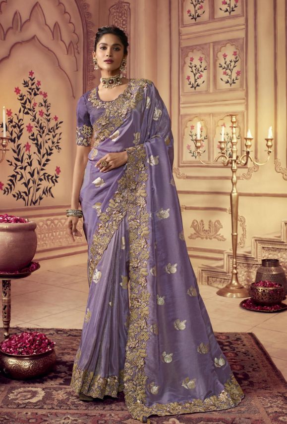 This saree is made of high-quality silk and features intricate embroidery, making it a unique and elegant garment. The deep hue is sure to make a statement and is perfect for special occasions. Crafted with skill and care, this saree is sure to turn heads. Stitching Option - We will email you the measurement guide to confirm your size. FABRIC: Fancy Silk SAREE FABRIC SIZE: 5.5 Meters BLOUSE FABRIC SIZE: 0.80 Meters SHIPPING: The product will be shipped within 1 - 2 weeks from the date of purchas Lavender Colour, Purple Saree, Zari Embroidery, Indian Designer Sarees, Indian Wedding Wear, Silk Saree Blouse, Wedding Saree Indian, Embroidered Border, Embroidery Saree