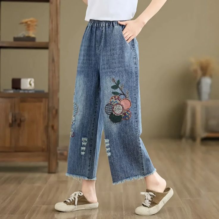 Discover Your New Favorite Jeans Step into the spring and summer seasons with style and comfort in our Floral Embroidered Vintage Jeans. Perfect for those who cherish a blend of classic charm and modern flair, these ankle-length denim pants are designed to elevate your casual wardrobe. The loose fit and elastic waist ensure a relaxed feel without compromising on style, making them ideal for various occasions, whether you're out for a stroll in the park or enjoying a weekend brunch. Exceptional F Jean Vintage, Middle Aged Women, Weekend Brunch, Jeans For Women, Urban Chic, Vintage Jeans, Style Moderne, Summer Season, Casual Wardrobe