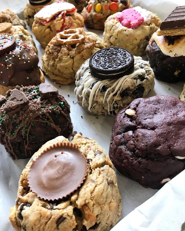 there are many different types of cookies in the box together, including one chocolate chip cookie