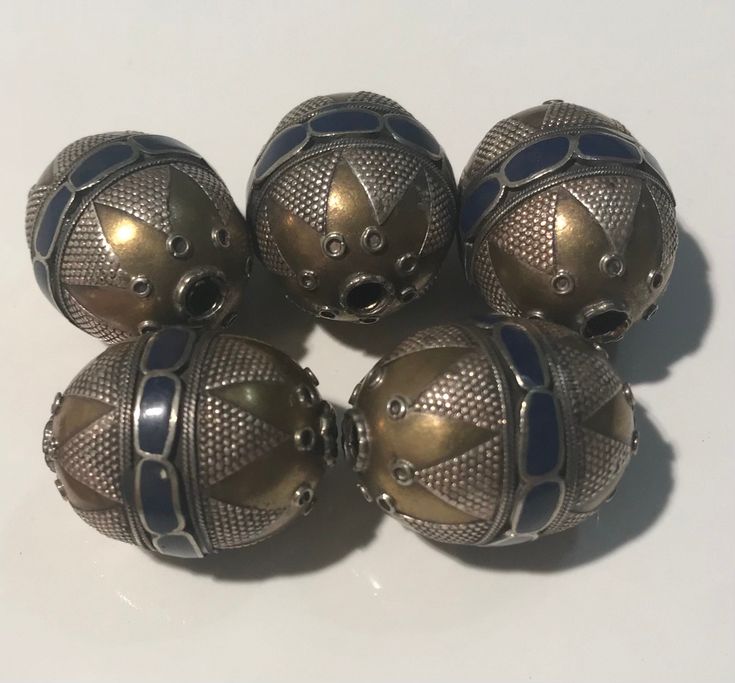 These are vintage Turkmen tribe silver gold gilded beads from Northern Afghanistan. It is all handmade by the best Turkmen tribe bead maker.  The beads are about 20 years old. Size: 1.1 inch long and 21mm In diameter The price is for 5 beads Traditional Jewelry With Bead Caps And Round Beads, Gold Bohemian Beads For Jewelry Making, Spiritual Silver Beads For Festival, Artisan Silver Spacer Beads, Traditional Handmade Metal Beads, Handmade Traditional Metal Beads, Bohemian Gold Beads For Ceremonial Use, Large Metal Beads For Jewelry Making, Ceremonial Large Spiritual Beads