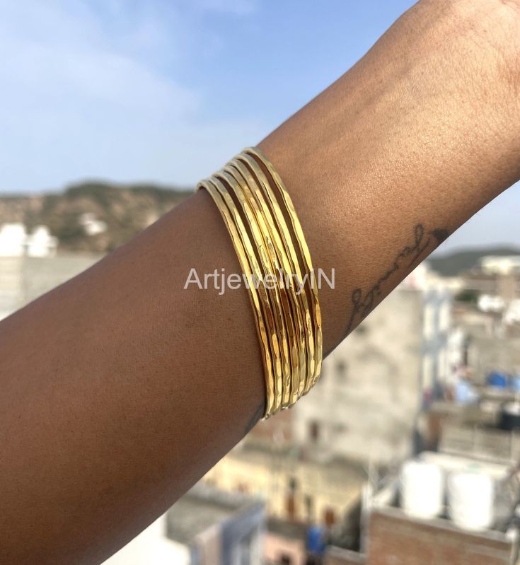 Hammered bangles, Bangles For Women, 7 Set of Solid Brass Stacking bangles, 14K Gold Plated bangles, 7 Day bangles, Brass Jewelry Gift Handmade item Materials: Brass Adjustable : No Style: Minimalist Bracelet Size Inches Circumference/Diameter 7 / 2.23 7.5 / 2.39 8 / 2.55 8.5 / 2.71 9 / 2.87 9.5 / 3 Elegant, , minimal and shiny ! A lovely basic to have in your wardrobe and wear anytime  O T H E R ∙ I N F O R M A T I O N * All items are nicely packaged ready to gift in elegant jewelry boxes. Plea Stackable Brass Bangle For Gift, Gold Stackable Brass Bangle, Stackable Brass Bangle As Gift, Stackable Brass Bangle Gift, Stackable Bangle Jewelry For Festivals, Stackable Festival Bangle Jewelry, Festival Stackable Bangle Jewelry, Stackable Bangle Bracelets For Festivals, Festival Stackable Bangles