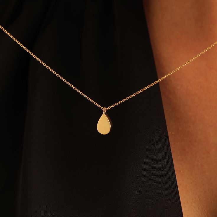 Real Gold Teardrop Necklace For Women, 14K 18K Gold Tear Drop Necklace, Flat Teardrop Pendant, Gift For Anniversary, Girlfriend Gift Pendant Caring for Your Necklace: After filling this cremation necklace with ashes or other contents using the provided filling kit, we strongly recommend sealing the pendant permanently with a non-water soluble adhesive, despite its threaded screw opening. You can choose the necklace length from 16" to 20". The "cable chain" is used for this necklace. Product Details 14K (585) - 18K (750)  Real Solid Gold (not gold plated ) All products are handmade. Size:13 mm Order Summary -All orders are shipped with a VIP gift box. -All of our products reach you within 2-3 business days via Ups Express cargo. -All personalizations are free. Necklace Length - 16 inches ad Yellow Gold Teardrop Charm Necklace With Delicate Chain, Gold Teardrop Drop Necklace For Gift, Gift Yellow Gold Drop Necklace, Anniversary Teardrop Drop Necklace With Delicate Chain, Anniversary Drop Necklace With Delicate Chain, Yellow Gold Teardrop Pendant Drop Necklace As Gift, Gold Teardrop Drop Necklace For Anniversary, Yellow Gold Teardrop Drop Necklace For Gift, Gold Drop Necklace For Anniversary