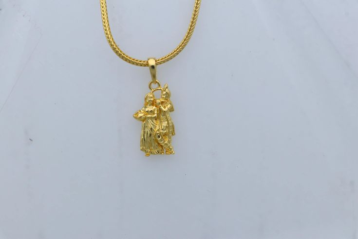 Metal-925 sterling silver (gold polished ) Item type-Pendant / locket Weight-2.170 grams. Height-2.9 centimetre. Width-1.2 centimetre. Stamped-925. Finish-gold polished Chain details: chain width-1.5mm(if buy) Weight-12.500 to 18.500 grams(weight vari as per length) Chain type-screw chain. Dual-tone 22k Gold Jewelry Gift, Festive 22k Gold Locket Jewelry, Gold Dual-tone Jewelry For Puja, Yellow Gold Round Pendant Jewelry For Diwali, 22k Gold Locket Jewelry For Festivals, Yellow Gold Round Pendant For Puja, 22k Gold Jewelry For Navratri Gift, Festive Gold Locket Jewelry, Traditional Yellow Locket Jewelry