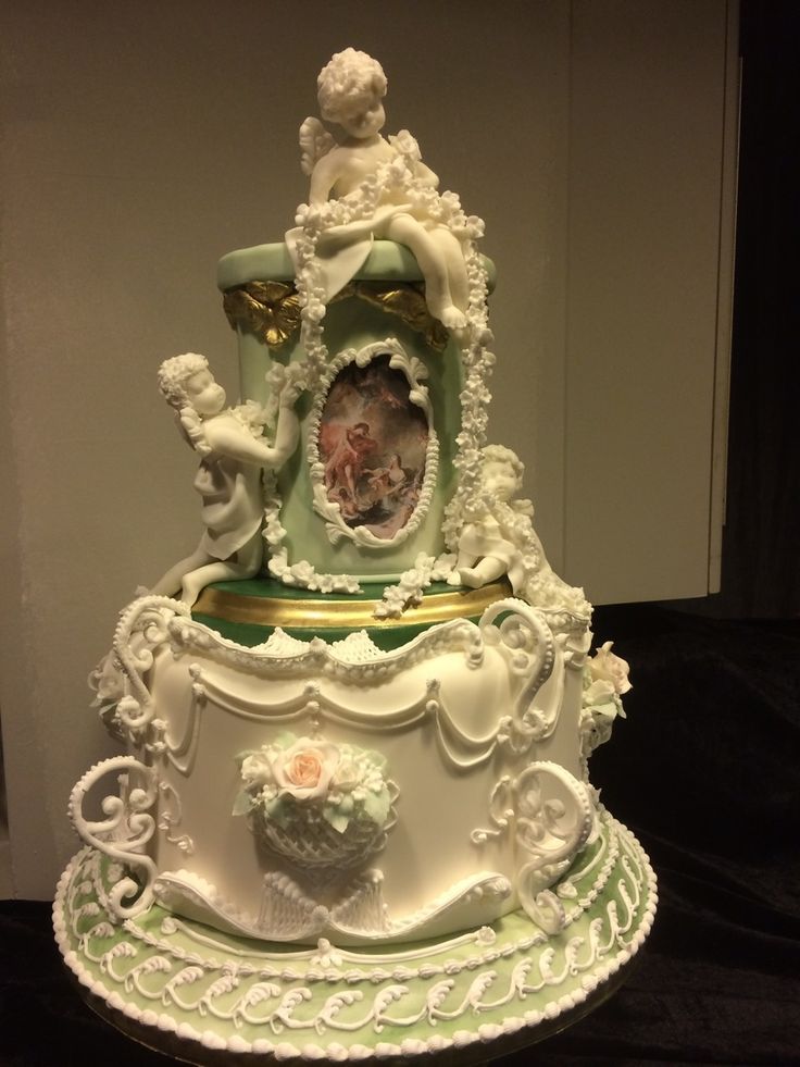 an elaborately decorated cake on display in a room