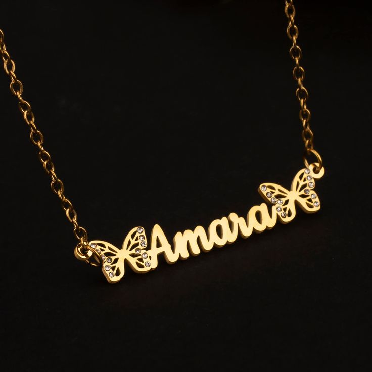 This necklace can be customized with your own name and handwriting, crafted from stainless steel with 18K gold plating. This personalized gift is a perfect choice for yourself or your loved ones. The necklace is meticulously handcrafted, ensuring both quality and style. It is fade-resistant, colorfast, and waterproof, made with high-quality materials and meticulous attention to detail. Key Features: Custom Butterfly Name Necklace: A delicate and trendy necklace personalized with your own name. D Personalized Rose Gold Stainless Steel Name Necklace, Adjustable Personalized Gold Name Necklace, Adjustable Customizable Gold Charm Necklaces, Personalized Stainless Steel Pendant Name Necklace, Personalized Stainless Steel Pendant Necklace, Personalized Stainless Steel Nameplate Jewelry, Rose Gold Name Necklace In Stainless Steel, Personalized Nameplate Necklace In Stainless Steel, Nameplate Jewelry In Stainless Steel