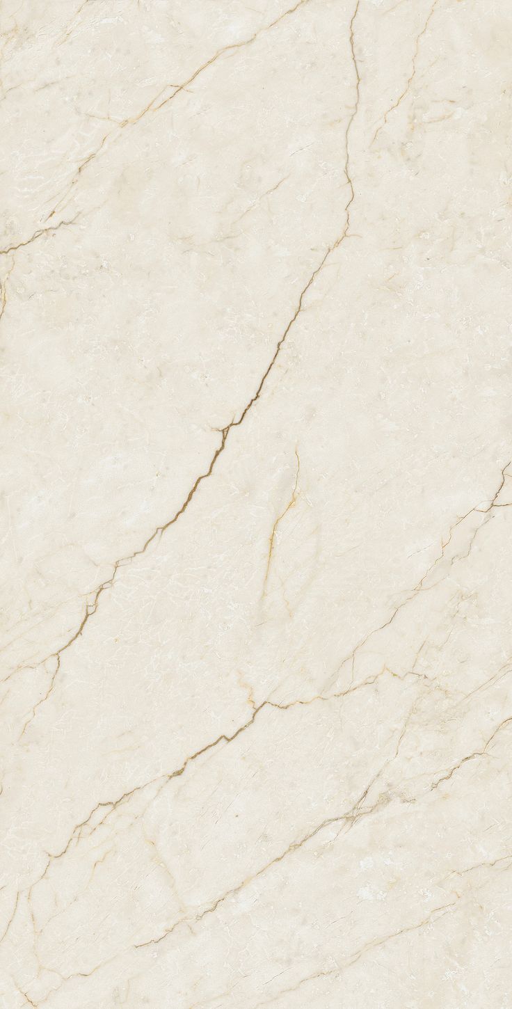 a white marble textured surface with cracks in it