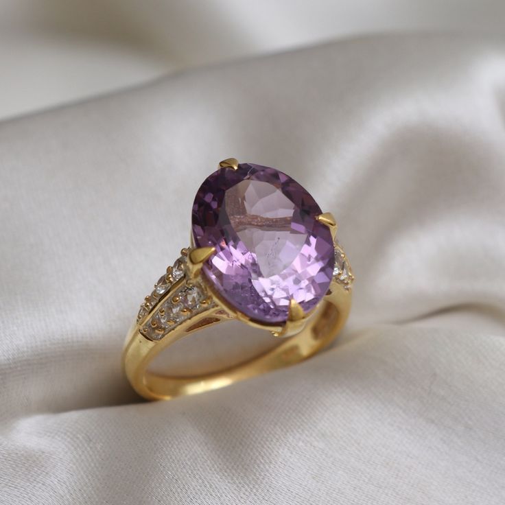 This Ring comes with a 100% Natural Amethyst  Gemstone and it is made up of 925 solid sterling silver. This ring is handcrafted by our skilled craftsmen and designed by us. Every gemstone is handpicked for the best quality. Materials:- 925 Solid Sterling Silver Gemstone:- Natural Purple Amethyst Item Weight :- approx. 5 Grams Stone Size :- 12 X 16 MM Stone Shape :- Oval Cut Secondary Stone :- 1.5mm Round Cut White Topaz Select Size in Variation , if you don't find perfect size please buy any siz Elegant Amethyst Crystal Ring With Accent Stones, Elegant Amethyst Crystal Ring With Center Stone, Elegant Amethyst Crystal Ring With Gemstone Accents, Elegant Purple Crystal Ring With Accent Stones, Elegant Amethyst Rings With Gemstone Accents, Elegant Amethyst Ring With Gemstone Accents For Promise, Elegant Purple Crystal Ring With Prong Setting, Classic Wedding Amethyst Ring With Gemstone Accents, Elegant Purple Birthstone Ring With Gemstone Accents