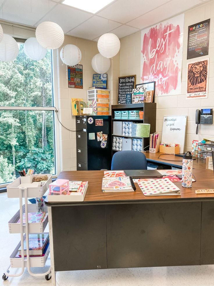 an office with lots of desks and posters on the wall