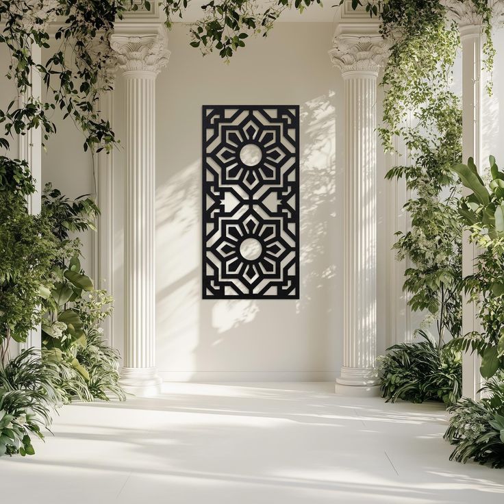 an art piece hanging on the wall in front of some plants and greenery with white walls