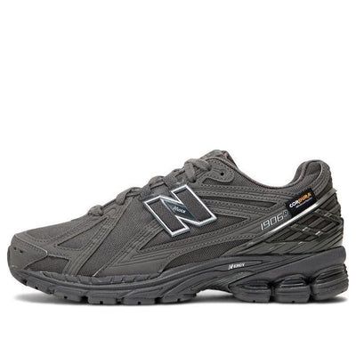 The New Balance 1906R Cordura 'Magnet' is a sleek and stylish sneaker designed for everyday wear. Its rubber sole and Cordura upper provide superior comfort and durability, while its dark gray colorway adds a subtle yet eye-catching touch. The 1906R is perfect for casual outings, outdoor activities, and everything in between. Its unique design is inspired by the classic 1906 silhouette, and its protective toe cap ensures your feet stay safe no matter where your day takes you. With its timeless style and reliable construction, the New Balance 1906R Cordura 'Magnet' is the perfect choice for any active lifestyle. (SNKR/Retro/Unisex/Low Top/Non-Slip/Breathable/Wear-resistant) Gray Lace-up Sneakers, Gray Sporty Sneakers Medium Fit, Gray Sneakers With Vibram Sole Medium Fit, Gray Sneakers With Vibram Sole And Medium Fit, Gray Sneakers With Vibram Sole, Gray High-top Running Shoes With Branded Insole, Gray New Balance Running Shoes With Rubber Sole, Carbon Color Running Sneakers With Boost Midsole, Gray Sneakers With Rubber Sole For Light Sports