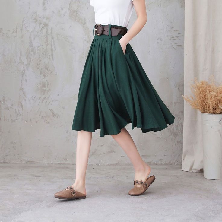 "Comfortable, gathered, a-line, knee-length skirt with high waistband. And it has pockets! This linen skirt will makes you a feminine and effortless look when paired with a tee or tank, and any of your well-loved heels, sneakers, clogs, flats, or sandals. On a breezy day, the wind sways your skirt like a sail. DETAIL * More colors * 50% linen, 50% cotton * No liner * Right hidden zipper closure * Two side pockets * with belt loops * High waistband * Pleated skirt * Knee length * Perfect for spri Green A-line Spring Bottoms, Green A-line Bottoms For Spring, Casual A-line Pleated Maxi Skirt, Casual Knee-length Culottes For Spring, Pleated Green Full Skirt, Casual Green Pleated Full Skirt, Green Skirt With Pleated Hem For Spring, Green Non-stretch Pleated Skirt, Summer Solid Color Relaxed Pleated Skirt