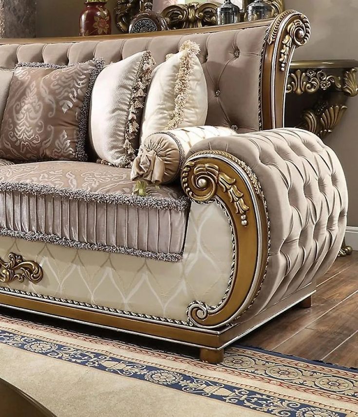 a fancy couch with many pillows on it