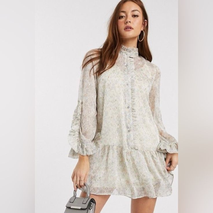 River Island Ditsy Floral Frill Smock Dress In Cream Uk Size 8 . Usa Size 4 . Brand New And So Cute. Looks Exactly Same As Model . She’s Also Wearing Usa Size 4 Feminine Ditsy Floral Print Mini Dress For Daywear, Feminine Ditsy Floral Mini Dress For Daywear, Flowy Smock Mini Dress For Daywear, Floral Mini Dress With Ruffles For Daywear, Mini Floral Dress With Ruffles For Daywear, Feminine Smock Mini Dress, Chic Beige Ditsy Floral Dress, Beige Floral Print Mini Dress For Daywear, Cream Mini Dress For Spring Daywear