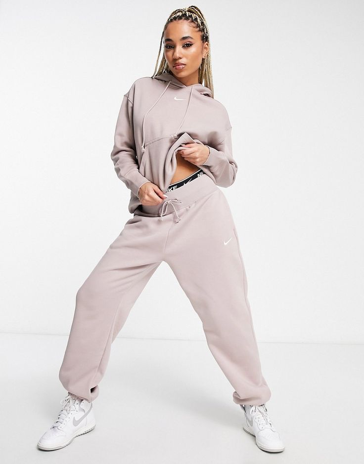 Joggers by Nike Can't go wrong in sweats Drawstring waistband Side pockets Nike logo embroidery Oversized, tapered fit Nike Sweat Suit, Nike Phoenix Fleece, Ensemble Nike, Nike Sweat Suits, Nike Trends, Sweat Suits Outfits, Oversized Sweatpants, Girls Joggers, Nike Joggers