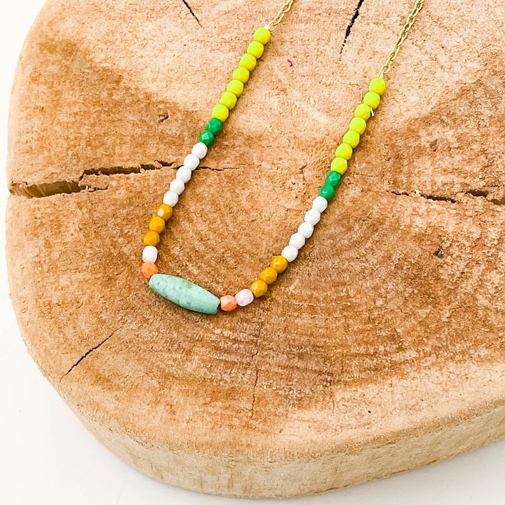 "A dainty necklace made with 3mm beads and a center natural Magnesite barrel bead in a gorgeous shade of turquoise, the chain is 24K antique gold plated and the necklace is fastened with a lobster clasp. BEAD COLORS: Chartreuse, Pale grey, Mustard, Lilac, Orange. The details: 24K GP dainty chain 3mm Czech glass beads 1 natural turquoise Magnesite barrel stone bead measuring 0.5\" long lobster clasp Made in our Burlington VT studio Shipped in a gift box." Tiny Bead Necklace, Mothers Day Necklace, Burlington Vt, Romantic Earrings, Cameo Earrings, Turquoise Bead Necklaces, Cameo Jewelry, Necklace Turquoise, Shades Of Turquoise