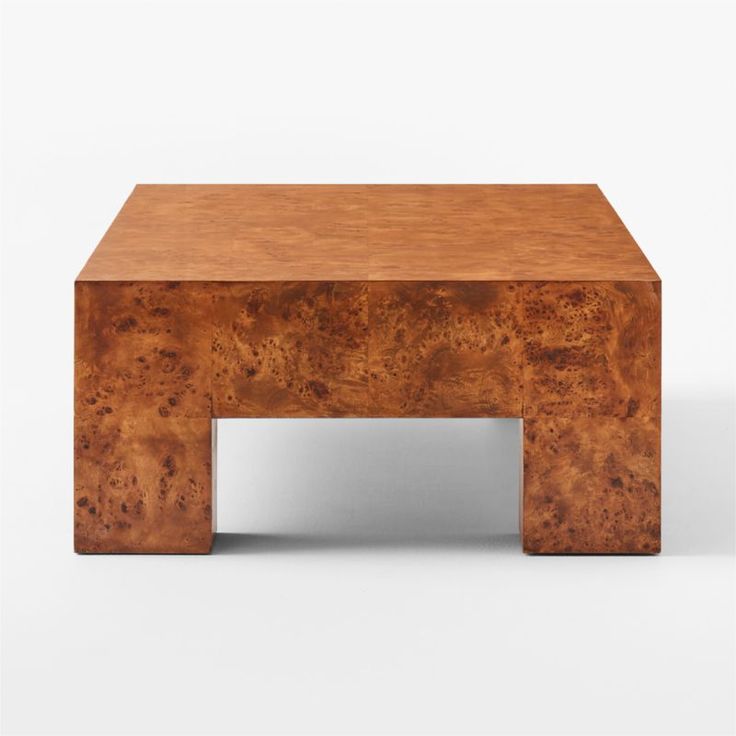 a coffee table made out of wood with no one sitting on the top or standing up