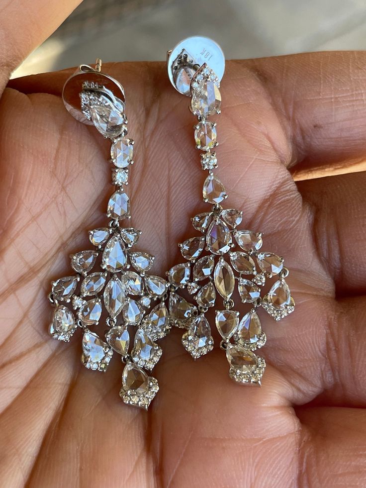 18k white Gold 7 carats long Diamond earrings , Diamond long Earrings,  Earrings, 18k White Gold, Gift for Her Diamond Shape: Round Brilliant and Rosecut Type Of Gold: White Gold Type Of Metal: 18K Gold Weight- 15.04 gms Rosecut Diamond Carat Weight: 6.09 carats Brilliant  Diamond Carat Weigh: .93 This earring is available in Rose Gold, White Gold and Yellow Gold for custom order Item #Inv#4S4000 Luxury Pear-shaped Chandelier Earrings For Formal Events, Luxury Rose Cut Diamond Earrings For Evening, Luxury Rose Cut Diamond Chandelier Earrings For Wedding, Luxury Diamond Drop Earrings, Luxury Drop Diamond Earrings, Luxury White Cubic Zirconia Linear Earrings, Luxury Diamond Accented Drop Chandelier Earrings, Diamond White Platinum Bridal Earrings For Evening, Luxury Drop Earrings With 17 Jewels