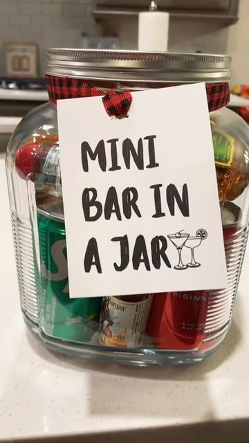 a mini bar in a jar with a sign attached to it that says, mini bar in a jar