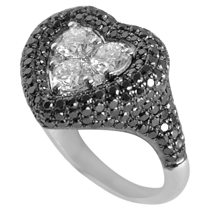 Three 0.20 carat round diamonds set in a cluster to form a heart shape in the Centre, outlining the heart shape with pave black diamonds. Available in 18k White gold. A true KAMYEN signature style, the heart pinky's have truly become synonymous with the brand. This ring should worn on the pinky or ring finger, as we don't recommend sizes above US 5. Luxury Heart-shaped Diamond Ring, Heart Cut Rose Cut Diamond White Rings, Luxury Heart Shaped Diamond Ring For Formal Occasions, White Gold Heart Cut Ring With Rose Cut Diamonds, Luxury Heart Cut Diamond Ring, Elegant Heart Cut Diamond Ring With Pavé Setting, Elegant Heart Cut Ring With Pave Setting, Wedding Rings With Pave Setting Heart Cut, Wedding Rings With Heart Cut Pave Setting