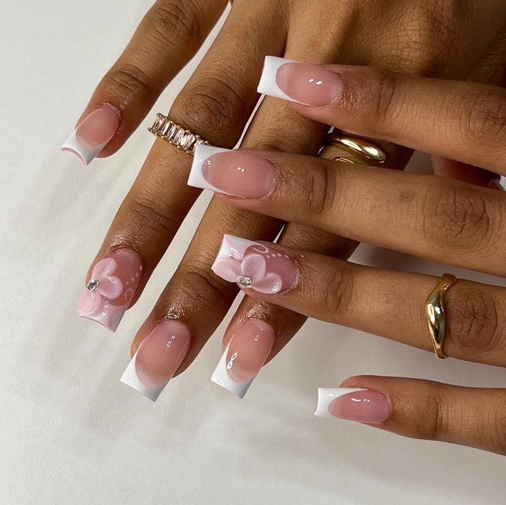 🌸 • • • • #nailsxkay #nailsnailsnails #apresnails #gelx #gelxnails #prettynails #trendynails #naildesign #nailart #nailextentions #bombnails #cutenails #baddienails #nailinspo #pinterestnails #trendynails #explore #explorepage #scvnails #calinails #LAnails #summernails #nailsofinstagram #LAnailtech #flowernails #frenchtipnails #3dflowernails Square White Nails Design, French Tips Styles, Almond Pink Flower Nails, Barbados Nail Design, Nails One Finger Design, Polly Gell Nail Designs, White Tip Acrylic Nails With Design, French Tip Acrylic Nails With Flower, Pink French Tip With Flowers