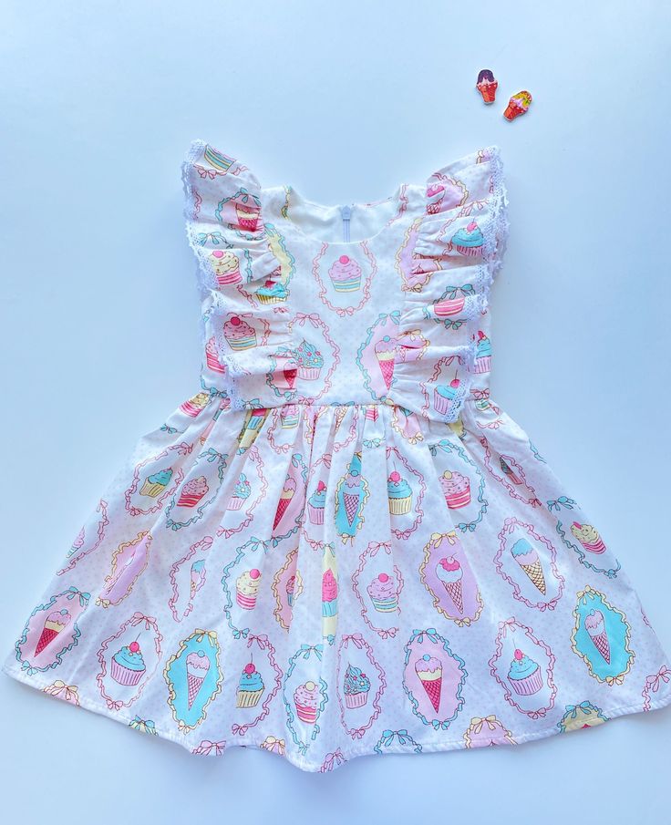 "The perfect cotton dress for girl. It is made of natural cotton, with ice cream print. The ruffles sewed with white cotton lace. Size information: age 0-3 months / height 22,05 \"- 22,83 '' (58-62 cm) / chest 17,72 '' (45 cm) age 3-6 months / height 26,77 '' (68 cm) / chest 19,29 '' (49 cm) age 6-9 months / height 29,13 '' (74 cm) / chest 20,08 '' (51 cm) age 9-12 months / height 31,5 '' (80 cm) / chest 20,87 '' (53 cm) age 12-18 months / height 33,86 '' (86 cm) / chest 21,86 '' (55 cm) age 2T Cute Ruffle Hem Dress For The Beach, Cute Ruffle Hem Dress For Beach, Cute Ruffle Dress With Ruffle Hem For Beach, Summer Playtime Twirl Dress With Ruffle Hem, Summer Twirl Dress With Ruffle Hem For Playtime, Beach Cotton Dress With Ruffle Hem, Beach Dress With Ruffle Hem In Cotton, Cute Summer Ruffle Dress For The Beach, Cute Ruffle Dress For Summer Beach