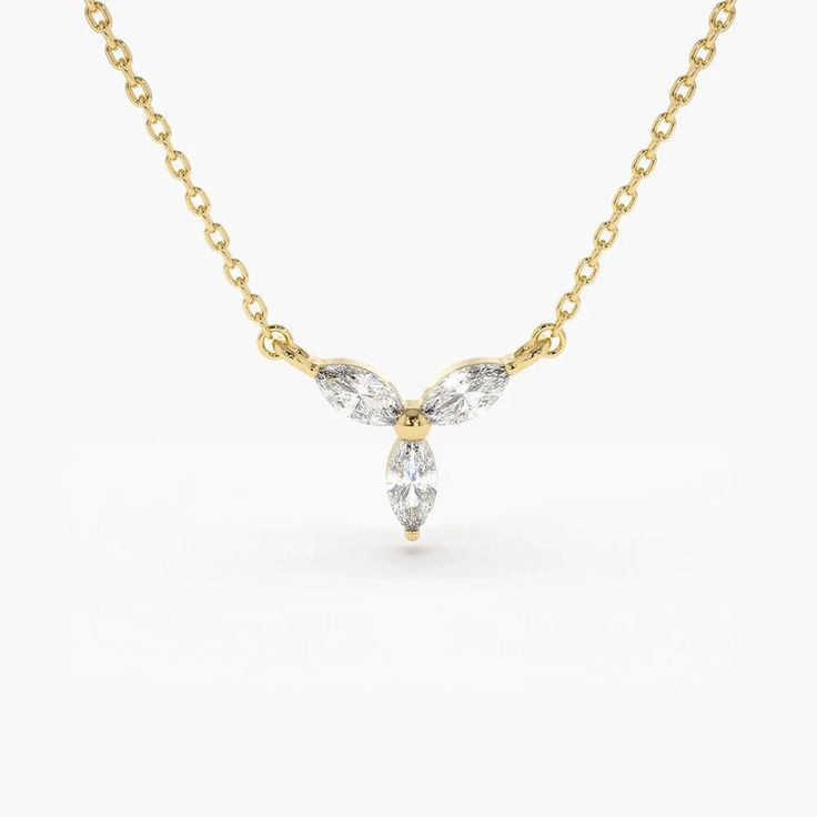 14K Gold Marquise Diamon Necklace Details	Made to Order.	Gold Kt: 14K Solid Gold	Custom Gold Color: Rose Gold, Yellow Gold, White Gold	Marquise Diamond: 3 pcs 4 x 2 MM	Total Number of Stones: 3	Total CTW: 0.20	Diamond Color Clarity: G Color Si1 Clarity	Setting Type: ProngContemporary and chic, this marquise diamon Necklace will give your everyday wear a luxury look. Th Necklace is handcrafted with a 14k gold chain and three stunning marquise diamonds arranged in an elegant leaf design. Treat yourself to the finer things in life like this custom-made diamon Necklace, designed for those with refined taste.  Shipping Time 10-12 Working Days Marquise Diamond Necklace, Gold Diamond Necklace, Marquise Diamond, Diamond Color, Necklace Sizes, Eternity Bands, Gold Yellow, Diamond Gemstone, Leaf Design