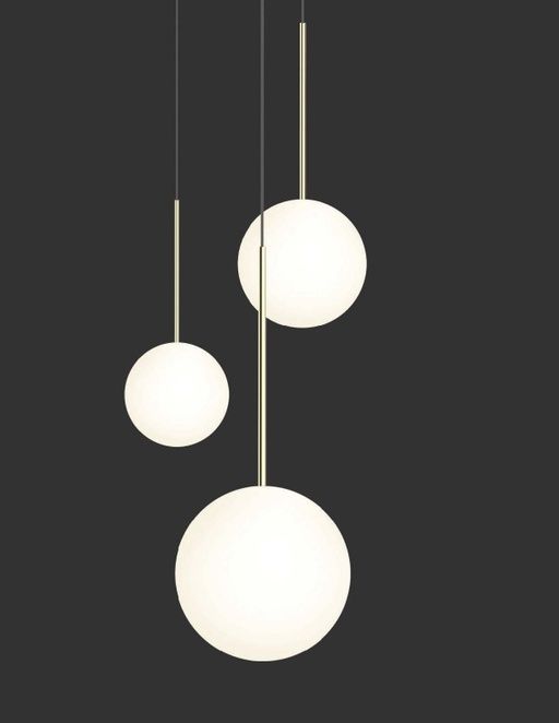 three light fixtures hanging from the ceiling in a dark room with black walls and flooring