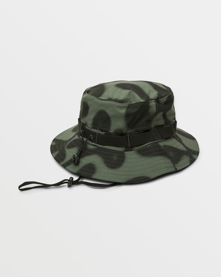 Take a little shade with you and embrace the breeze with the FA Zephyr Boonie Hat. This unstructured bucket hat features a performance fabric blend with a sublimation print, side mesh panels for added breathability, and a drawcord for a custom, snug fit.
 Featured artist Zephyr Christakos-Gee, is a Toronto-born visual artist influenced by cartoons, video games, and graffiti. Featured here in green. - 
 - 98% Polyester / 2% Nylon
 - Brimmed boonie bucket hat
 - Unstructured performance fabric with sublimation print and side mesh panel and draw cord with stopper
 - Stone logo front logo patch Stone Logo, Boonie Hat, Mesh Panel, Performance Fabric, Featured Artist, Visual Artist, Snug Fit, Patch Logo, Sublimation Printing