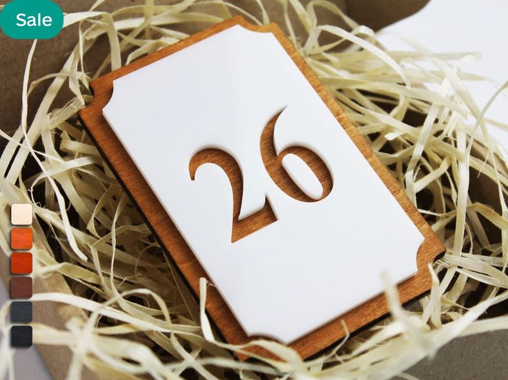 a close up of a box with a sign in the shape of a bird's nest