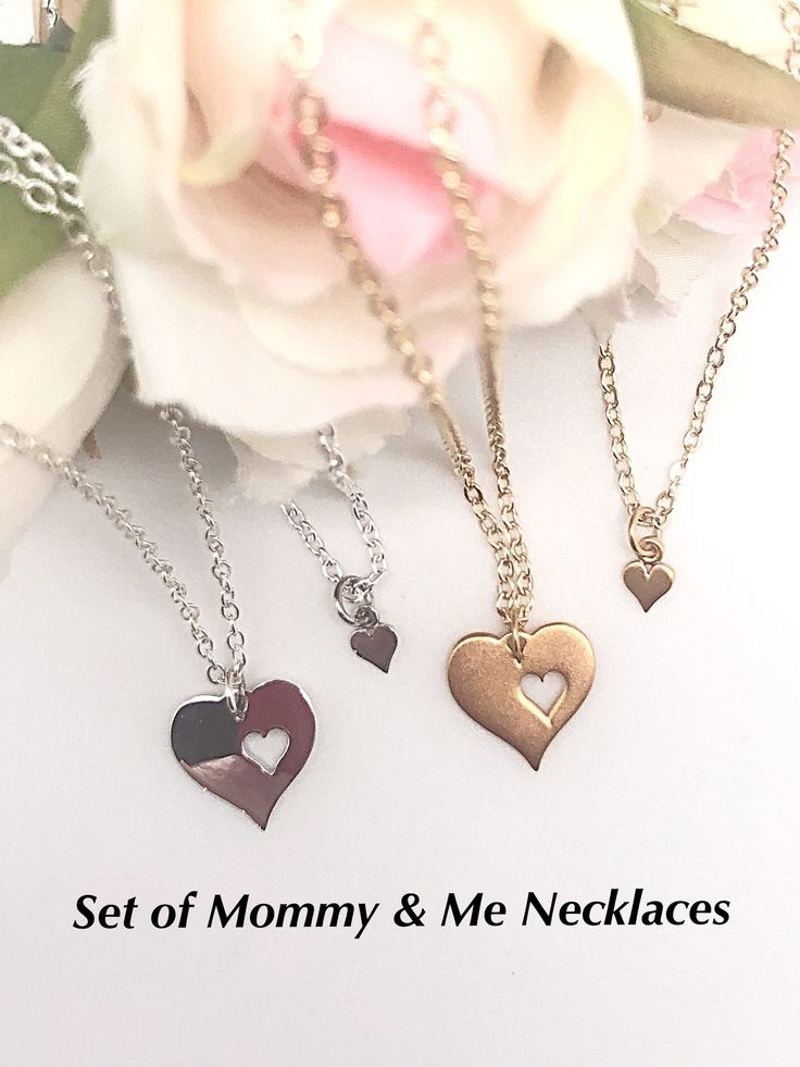 "Aren't these cut out heart necklaces too cute? This is a great Baby Shower gift idea for someone's first baby! Also, you could order the set and hang the tiny heart over the large heart while you're expecting! You can order the same finish chain as the heart or let your imagination go wild and create your own idea! Let's talk about it! Each heart comes with either a sterling silver chain or a gold filled chain in your chosen size and in newborn to 12 months (11\"). You could also add a birthsto Everyday Heart Charm Necklace For Mother's Day, Everyday Heart Charm Necklaces For Mother's Day, Open Heart Birthstone Charm Necklace, Heart Beads Necklace For Mother's Day, Everyday Heart Beads Necklace For Mother's Day, Cute Personalized Heart Necklace For Mother's Day, Cute Heart Necklace For Mother's Day Gift, Heart Shaped Necklace For Mother's Day, Cute Gold Jewelry For Mother's Day