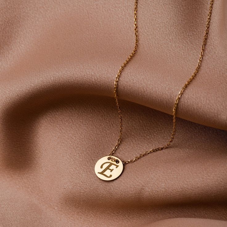 Personalized initial necklace in 14K solid gold or sterling silver 925. Create your custom letter necklace exactly as you want it. Write the monogram of your name or of the name of your beloved. Available in two simple dainty designs, disc and hexagon. The best Valentines day gift. 100% handcrafted with love! PRODUCT DETAILS ● Material: 14K solid gold, 14K white gold, sterling silver 925 ● Hexagon Diameter: 11mm ● Disc Diameter: 11mm ● Length: 16 inches (Please contact if you need a different length) HOW TO ORDER - CUSTOM ORDERS ●Choose from the drop down menus the available options (Material) and leave us a note for any special requirements. ●For special orders forward us pictures and our designer will do the best to meet your expectation.  PRODUCTION TIME - SHIPPING POLICIES ●Please keep Luxury 14k Gold Initial Necklace For Formal Occasions, Luxury Initials Round Pendant Jewelry, Timeless Gold Jewelry Stamped 14k, Timeless 14k Stamped Gold Jewelry, Formal White Gold Jewelry With Initials, Formal Personalized Initial Necklace In Fine Jewelry Style, Formal Personalized Initial Necklace Fine Jewelry, Luxury Personalized Gold Initial Necklace, Classic Gold Initial Necklace For Formal Occasions