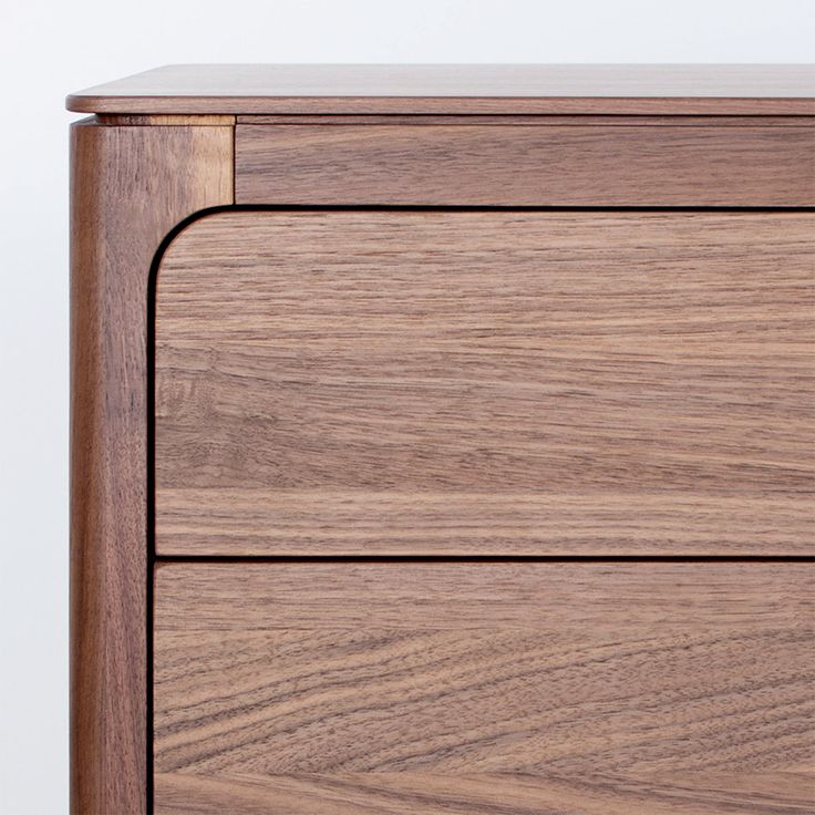 the side view of a wooden dresser with two drawers