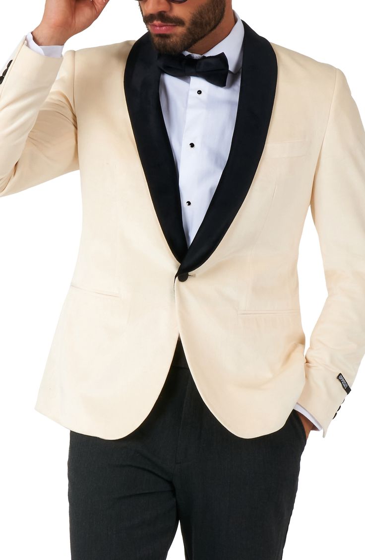 Bubbly Champaigne inspires the smart ivory hue of a dinner jacket framed in black-satin lapels with a fabric-wrapped button cinching the formal look. One-button closure Shawl collar Nonfunctional four-button cuffs Chest welt pocket; front slant pockets Back vent Lined 100% polyester Machine wash, line dry Imported Ivory Tux, Christmas Blazer, Tuxedo Prom, Velvet Dinner Jacket, Shirts For Teens Boys, Prom Tuxedo, Halloween Suits, Christmas Suit, Burgundy Blazer