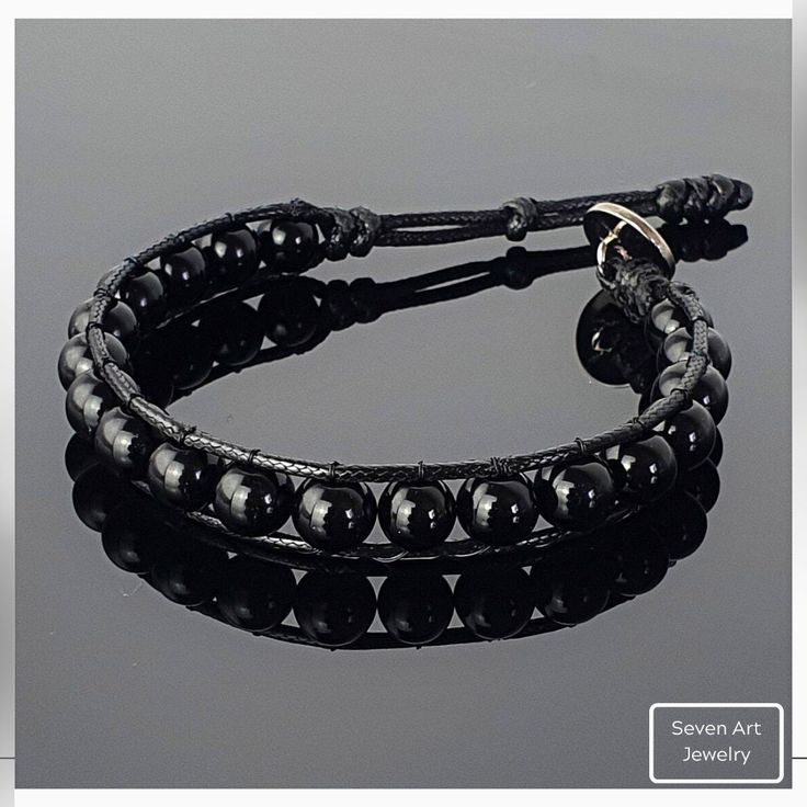 This bracelet made with natural 8mm Black Onyx gemstone. It is a perfect gift for you and all your loved one for all special days. All our designs prepared by hand according to the your given sizes with love. Wrap is durable 1,5 mm polyester black rope. For closure of our high quality bracelet we used zamak alloys button with 2 optional closure buttonhole. Properities of Gemstone that we used; -Onyx; Onyx is a stone that offers up powerful vibrations of protection, strength, focus, and willpower Spiritual Black Wrap Bracelet Gift, Spiritual Black Wrap Bracelet For Gift, Modern Adjustable Black Beaded Jewelry, Modern Adjustable Jewelry With 8mm Beads, Modern Adjustable Onyx Bracelet, Adjustable Round Onyx Beaded Bracelet, Adjustable Round Onyx Bracelets, Adjustable Onyx Beaded Bracelet, Black Spiritual Wrap Bracelet With Round Beads