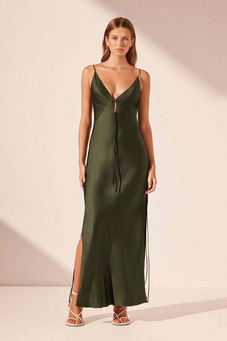 Plunged slip tie maxi dress in a LENZING ™ ECOVERO ™ Viscose with a luxurious matte finish. Modern Minimalistic Bridesmaid Dress, Fosil Green Bridesmaid Dress, Formal Wedding Guest Dress Winter Shoes, Green Velvet Satin Dress, Luxury Elegant Summer Dress Shoes, Green Maxi Dress Christmas, Luxury Green Maxi Dress For Prom, Grove Color Dress, Green Satin Dress Lulus