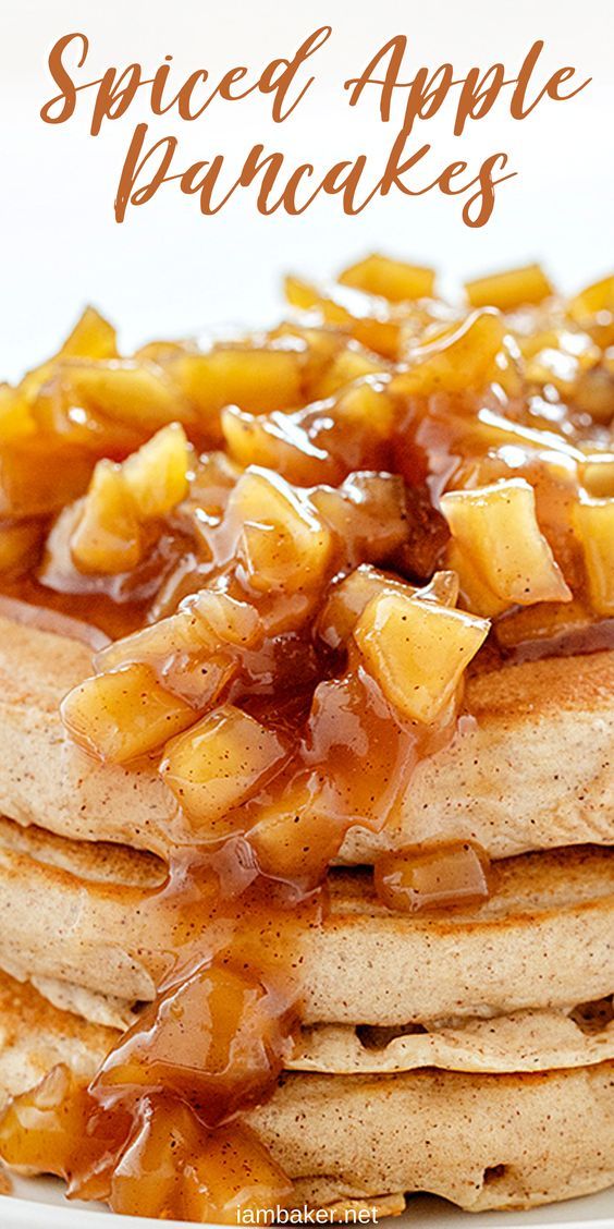 a stack of pancakes covered in caramel syrup and apple toppings on a white plate