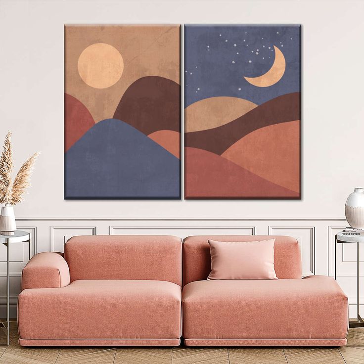 two paintings are hanging on the wall above a couch