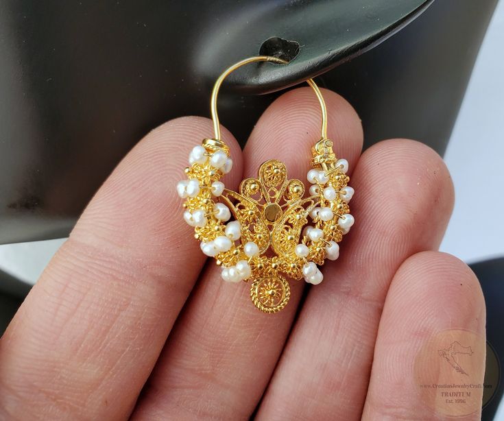 "★ Traditional Croatian filigree hoop earrings locally called Rećine . True handcrafted replica of traditional Croatian ethnic, heritage jewelry from Dalmatia region. Adorned with natural, white freshwater pearls. Meticulously handcrafted solid 14k gold filigree metalwork. ★ *These earrings are handmade on order in 7-10 business days* Due to the handmade creation, every pair is unique, so there can be tiny variations in dimensions of the finished earrings. They are on average: Overall height: 3. Pierced Hoop Earrings For Wedding, Filigree Round Hoop Earrings For Wedding, Delicate Yellow Gold Hoop Earrings For Wedding, Filigree Round Jewelry For Marriage, Filigree Jewelry For Marriage, Small Hoop Earrings For Wedding, Small Hoop Pierced Earrings For Wedding, Traditional Hoop Earrings With Intricate Design For Anniversary, Small Hoop Filigree Jewelry For Anniversary