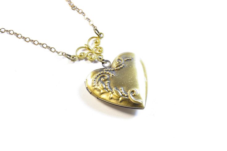 This Sweetheart Locket is adorned with embossed with a beautiful floral motif. It opens to hold two photos or mementos for your memories. A lovely gift for anyone one you love. Bridal, Bridesmaids, Valentine's Day Gift. Measures: 25.5mm wide, 26mm long, 7mm thick Inner Measurement: 18mm x 14mm ♥♥Each piece is custom made to order just for you! ♥ All items come packaged in a jewelry organza bag ready for gift giving! Gift boxes are an additional fee. To review return policies and jewelry care cli Vintage Heart Charm Locket Necklace For Wedding, Vintage Locket Necklace With Heart Charm For Wedding, Elegant Vintage Charm Heart Necklace For Valentine's Day, Elegant Heart Necklace With Vintage Charm For Valentine's Day, Elegant Vintage Heart Necklace For Valentine's Day, Vintage Heart Pendant Locket Necklace For Wedding, Vintage Charm Heart Pendant Necklace For Wedding, Double Heart Locket Necklace For Valentine's Day Wedding, Double Heart Locket Necklace For Wedding And Valentine's Day