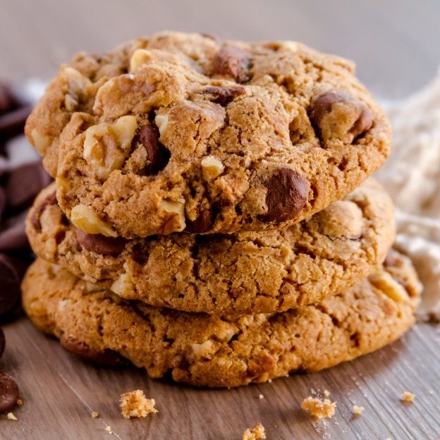 three chocolate chip cookies stacked on top of each other