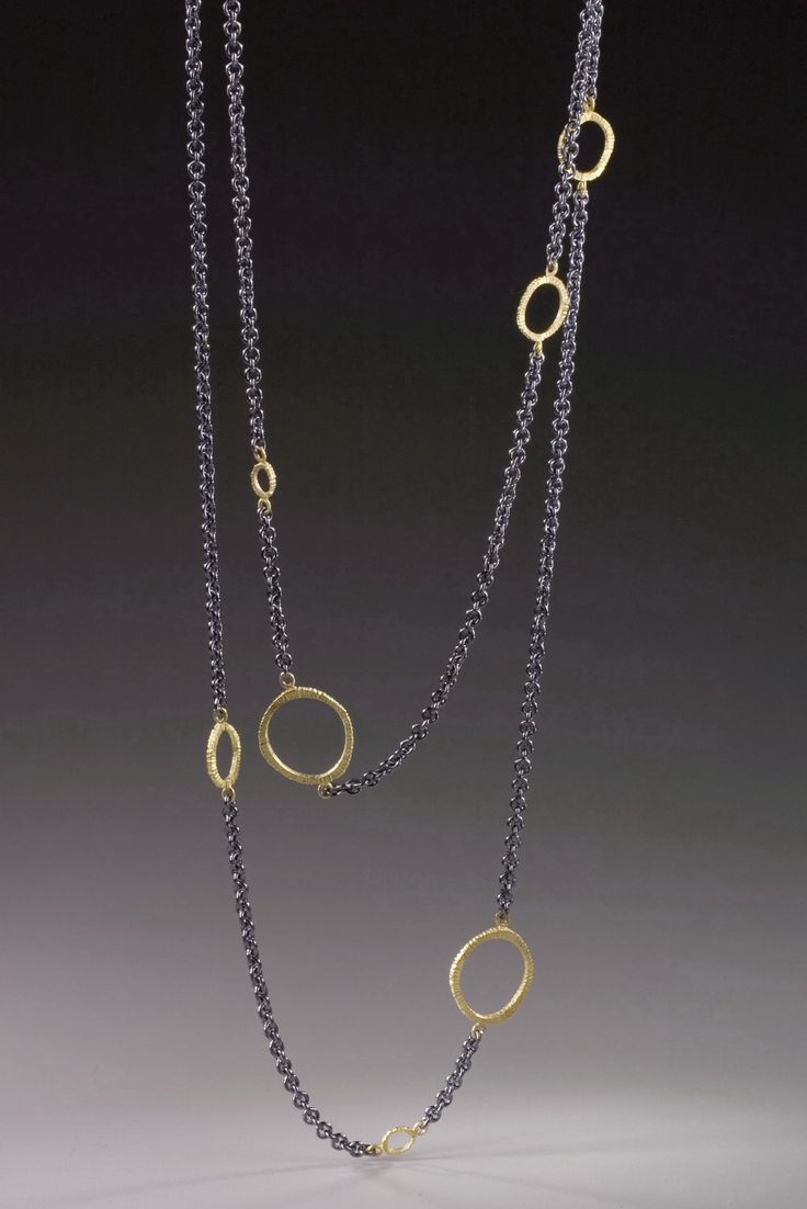 Floating Dig Circle Necklace by Dahlia Kanner. This patinated sterling silver necklace is adorned with a series of loops that add a playful touch to the 36L chain, which can be worn long or doubled, as shown. Choose 18k gold or patinated silver loops (not shown). 0.5W Elegant Double Strand Necklaces With Unique Variations, Gold Oxidized Long Necklace, Elegant Brass Necklaces For Layering, Elegant Hammered Silver Chain Necklace, Elegant Silver Hammered Chain Necklace, Contemporary Oxidized Jewelry For Formal Occasions, Formal Fusion Jewelry With Oxidized Finish, Elegant Hand-cast Jewelry, Modern Oxidized Finish Formal Necklace