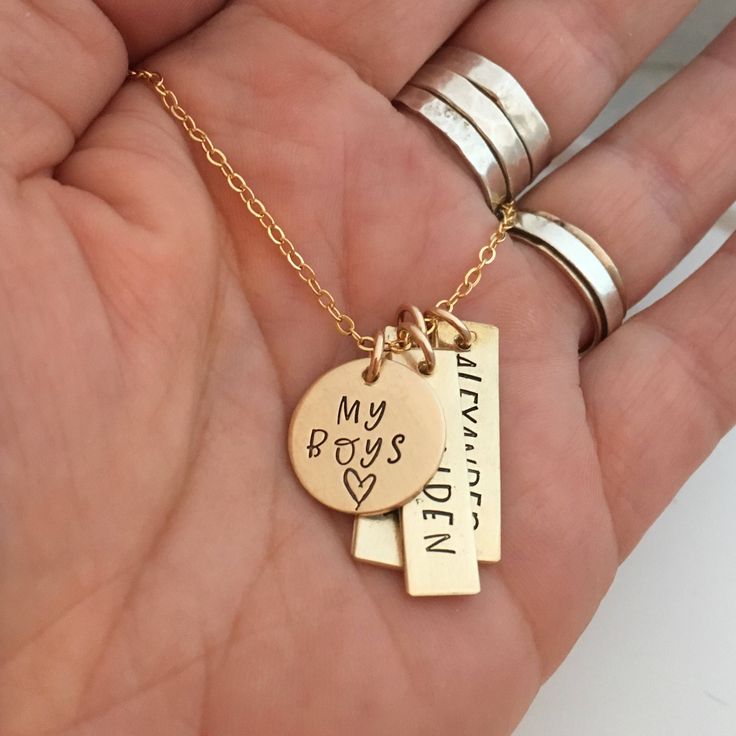 "My Boys - hand stamped personalized necklace - mothers necklace - Gift for Mom of Boys - Gold Filled Mommy Necklace - Gold Mom Necklace 1 5/8\" gold filled disc stamped \"my boys\" 1\" gold filled rectangle name tags (You choose how many name tags you need from the drop down box) The charms hang from a gold filled cable chain. Info to include in the notes to seller during checkout: names/words to stamp on each charm length of chain (16, 18 or 20 inches) As with all hand stamped jewelry, each pi Hand Stamped Name Necklace For Mother's Day, Stamped Charm Necklace For Mother's Day, Personalized Necklace For Mother's Day Gift, Everyday Stamped Charm Necklace For Mother's Day, Hand Stamped Necklaces For Mother's Day, Mother's Day Hand Stamped Charm Necklaces, Personalized Dog Tag Necklace For Mother's Day, Personalized Mother's Day Name Necklace, Personalized Meaningful Pendant Charm Necklaces