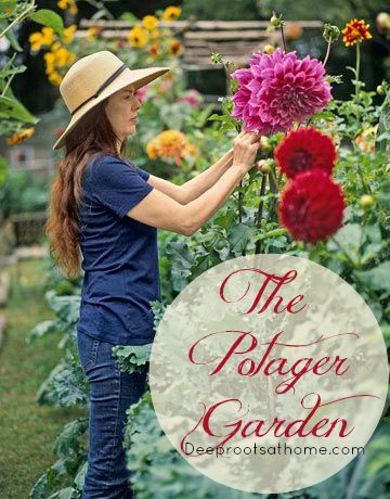 a woman in a hat picking flowers from a garden