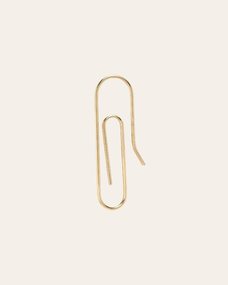 Modern and edgy 14k solid gold paper clip earring. It will be your new favorite ear accessory! Sold as a Single Size: Approx. 7mm(W) by 23mm(H) Total Weight: Approx. 0.5 grams Standard Production: 3-7 business days Rush Order Production: 2-5 business days Shipping: Select shipping method at checkout. Shipped from our L.A. Studio. This item is Final Sale. See here for details. Paper Clip Earring, Clip Earring, Gold Paper, Paper Clip, Clip On Earrings, Rush, Final Sale, Solid Gold, Unique Style