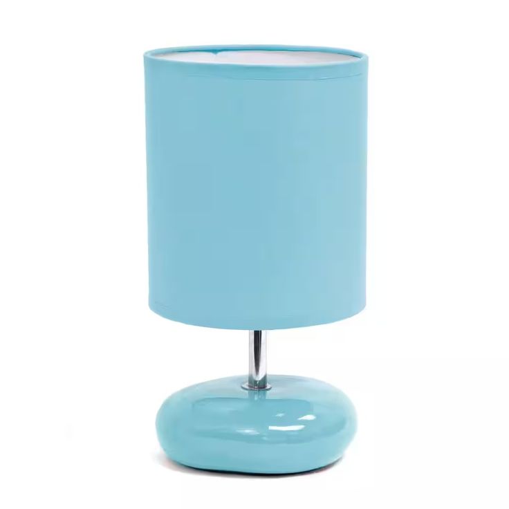 a blue table lamp on a white background