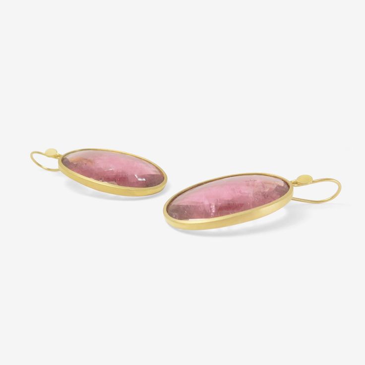 Details Lola Brooks 18k yellow gold & large checkered pink tourmaline oval earrings, 60.49ct. Each stone is set in Lola’s signature fine bezel & measures approximately 1 1/8″ x 3/4″. When hanging, the earrings measure approximately 1 3/4″ from the top of the ear wire to the bottom of the earring. - pink tourmaline, 60.49ct - 18k yellow gold - 1 3/4" total length - each earring weighs 7.96g Luxury Tourmaline Jewelry In Oval Cabochon Shape, Luxury Tourmaline Jewelry With Oval Cabochon, Luxury Tourmaline Oval Cabochon Jewelry, Modern Oval Cabochon Earrings, Modern Yellow Gold Jewelry With Oval Cabochon, Modern Yellow Gold Oval Cabochon Jewelry, Luxury Oval Pink Earrings, Luxury Pink Oval Earrings, Modern Pink Earrings For Formal Occasions