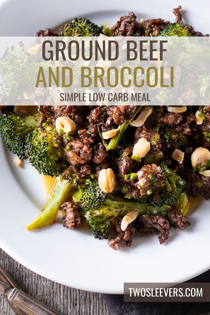 a white plate topped with broccoli and ground beef next to a wooden table